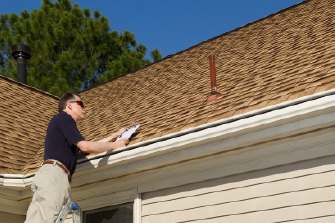 RoofEXT Worker inspecting a roof